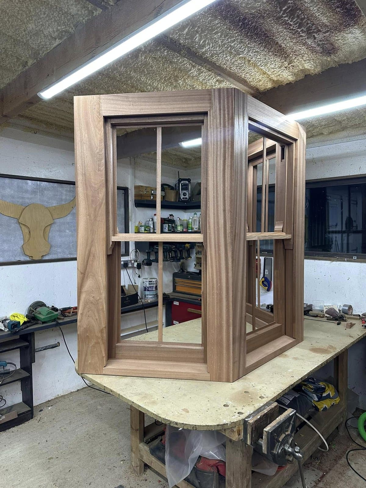 Bespoke walnut bay window mid-build on the workshop bench