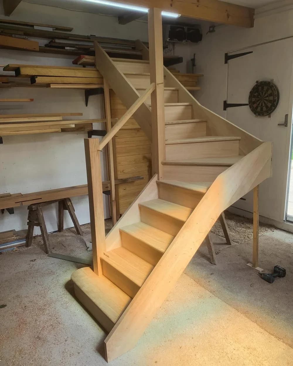 Hand-built oak staircase mid-installation in our workshop