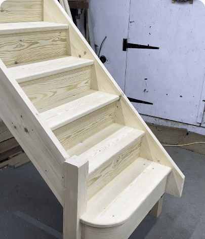 Hand-built pine staircase finished and standing in the workshop — TikTok video thumbnail with 2,333 views